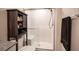 Clean bathroom with a walk-in shower and linen storage at 9131 Hitmaker St, Las Vegas, NV 89113