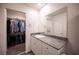 Elegant bathroom with granite countertop and walk-in closet at 9131 Hitmaker St, Las Vegas, NV 89113