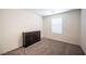 Simple bedroom with dresser and window with blinds at 9131 Hitmaker St, Las Vegas, NV 89113