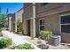 Townhome exterior with walkway and landscaping at 9131 Hitmaker St, Las Vegas, NV 89113