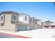 Row of attached garages in a townhome community at 9131 Hitmaker St, Las Vegas, NV 89113