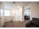 Bright hallway leading to bedrooms and a sitting area at 9131 Hitmaker St, Las Vegas, NV 89113