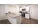 Modern kitchen with white cabinets and granite countertops at 9131 Hitmaker St, Las Vegas, NV 89113