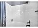 White tiled bathroom with a shower/tub combo at 9131 Sangria Ln, Las Vegas, NV 89147