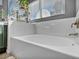 Relaxing bathroom with soaking tub and tiled walls at 9131 Sangria Ln, Las Vegas, NV 89147