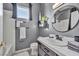 Clean bathroom with gray walls, white tile, and modern vanity at 9131 Sangria Ln, Las Vegas, NV 89147