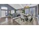 Bright dining room with hardwood floors and modern light fixture at 9131 Sangria Ln, Las Vegas, NV 89147