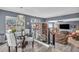 Bright dining room with modern light fixture and access to living room at 9131 Sangria Ln, Las Vegas, NV 89147