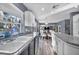 Open kitchen features granite counters and views into dining area at 9131 Sangria Ln, Las Vegas, NV 89147