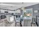 Modern kitchen with white and black cabinets and granite countertops at 9131 Sangria Ln, Las Vegas, NV 89147