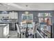 Modern kitchen with white and black cabinets and granite countertops at 9131 Sangria Ln, Las Vegas, NV 89147