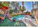 Refreshing pool with waterfall, lawn, and patio furniture at 9131 Sangria Ln, Las Vegas, NV 89147