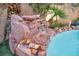 Serene waterfall feature cascading into the refreshing pool at 9131 Sangria Ln, Las Vegas, NV 89147