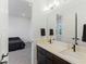 Shared bathroom with double vanity and modern fixtures at 9525 Ponderay Ct, Las Vegas, NV 89149