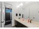 Modern bathroom with double vanity and a walk-in shower at 9525 Ponderay Ct, Las Vegas, NV 89149