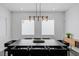 Elegant dining room featuring a large table and modern chandelier at 9525 Ponderay Ct, Las Vegas, NV 89149