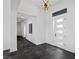 Bright and airy foyer with dark gray tile floors at 9525 Ponderay Ct, Las Vegas, NV 89149