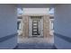 Stylish modern front door framed by stone pillars and ample natural light at 9525 Ponderay Ct, Las Vegas, NV 89149