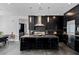 Sleek kitchen featuring dark cabinetry and a center island at 9525 Ponderay Ct, Las Vegas, NV 89149