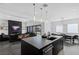 Spacious kitchen with island and views into the Gathering room at 9525 Ponderay Ct, Las Vegas, NV 89149