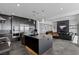 Spacious open-concept living room connected to modern kitchen featuring an island with pendant lighting at 9525 Ponderay Ct, Las Vegas, NV 89149