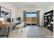 Bright home office with built-in shelving and sliding glass door at 9525 Ponderay Ct, Las Vegas, NV 89149