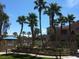 Inviting community pool and surrounding landscape at 9975 Peace Way # 2089, Las Vegas, NV 89147