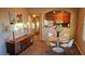 Bright dining area with glass table and four chairs, near the kitchen at 9975 Peace Way # 2089, Las Vegas, NV 89147