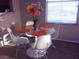 Bright dining area with glass table and four modern chairs at 9975 Peace Way # 2089, Las Vegas, NV 89147