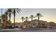 Attractive community entrance with palm trees and building view at 9975 Peace Way # 2089, Las Vegas, NV 89147