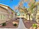 Pathway through a community with trees and landscaping at 100 S Crestline Dr # 57, Las Vegas, NV 89107