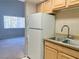 Kitchen with white appliances and double sink at 100 S Crestline Dr # 57, Las Vegas, NV 89107