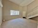 High ceiling living room with large window and stairs at 100 S Crestline Dr # 57, Las Vegas, NV 89107