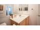 Clean bathroom with light wood cabinets and a large vanity at 10009 Dusty Winds Ave, Las Vegas, NV 89117