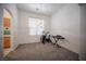 Bright dining area with large window and space for exercise equipment at 10009 Dusty Winds Ave, Las Vegas, NV 89117