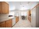 Bright kitchen featuring granite countertops and wood cabinets at 10009 Dusty Winds Ave, Las Vegas, NV 89117