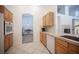 Kitchen features granite countertops and ample wood cabinetry at 10009 Dusty Winds Ave, Las Vegas, NV 89117