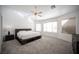 Large main bedroom with a platform bed and ceiling fan at 10009 Dusty Winds Ave, Las Vegas, NV 89117