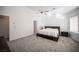 Spacious main bedroom with a platform bed and ceiling fan at 10009 Dusty Winds Ave, Las Vegas, NV 89117