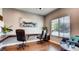 Convenient home office with built-in desk and two executive chairs at 1036 Novara Ln, Las Vegas, NV 89144