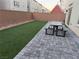 Artificial turf backyard with patio and picnic table at 10411 Rose Palisade St, Las Vegas, NV 89141