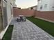 Artificial turf and paver patio with picnic table at 10411 Rose Palisade St, Las Vegas, NV 89141