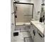 Clean bathroom with a walk-in shower and double vanity at 10411 Rose Palisade St, Las Vegas, NV 89141