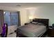 Spacious bedroom with a king-size bed and ample natural light at 10411 Rose Palisade St, Las Vegas, NV 89141