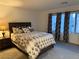 Comfortable bedroom with ample natural light and modern decor at 10411 Rose Palisade St, Las Vegas, NV 89141