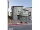 Two-story house with gray siding, gray garage door, and paved driveway at 10411 Rose Palisade St, Las Vegas, NV 89141