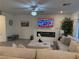 Living room featuring a fireplace and comfortable seating at 10411 Rose Palisade St, Las Vegas, NV 89141