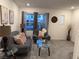 Bright living room with gray sofas and a glass coffee table at 10411 Rose Palisade St, Las Vegas, NV 89141