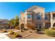 Two-story townhome with attractive facade and landscaping at 10550 W Alexander Rd # 1156, Las Vegas, NV 89129