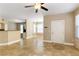 Open concept living room with tile floors and access to kitchen at 10550 W Alexander Rd # 1156, Las Vegas, NV 89129